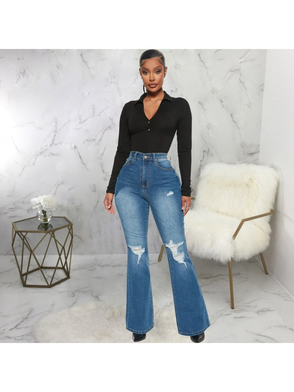 : A pair of women's high-waisted blue flare jeans with stylish distressed detailing.